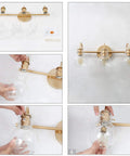Gold 3 Light Vanity Light Fixture Over Mirror With Globe Clear Glass Shades shown in assembly process