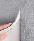 Game Changing 6 Mm Thick Peel And Stick Foam Wall Panels With Double Sided Aluminum Foil being applied to wall surface.