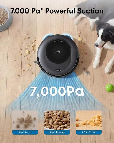 Omni C20 Robot Vacuum And Mop Combo With 7000 Pa Suction cleaning pet hair, food, crumbs on wood floor, dog watching