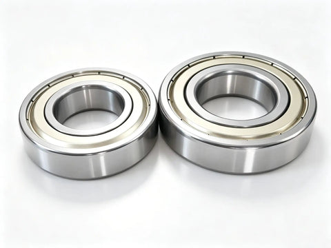 Slap On This Heavy Duty Washer Tub Bearing Seal Kit To Stop Grinding Groans And Drum Leaks Fast Your Machine Will Run Like New For Smooth Quiet Laundry Days Ahead. Close-up of two shiny metal bearings.