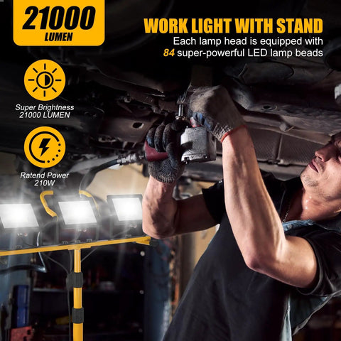 Mechanic using Beastly Bright 21000 Lumen LED Tri Head Work Light On Stand With IP66 Waterproof Tripod for undercar work.
