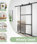 34x84 Inch Frosted Glass Barn Door With Black Carbon Steel Frame Top Mounted Hardware Kit No Fuss Soft Close Tempered Glass Sliding Door For Privacy Easy Assembly For Bathroom Laundry Kitchen Or Living Room installed view in living area.