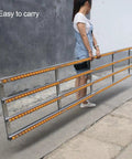 Heavy Duty Lightweight Unpowered Roller Conveyor Guides For Package Delivery With Durable Abs Plastic Rollers Perfect For Warehouse Shipping And Packing Workflows In 30 40 Or 50cm Yellow Styles, being carried by a person.