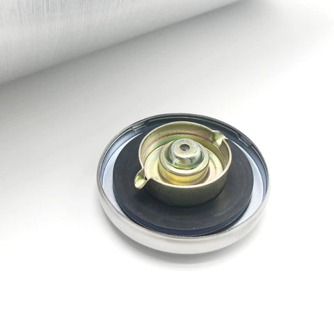 Close-up of a center-fill cap part of Aluminum Fuel Tank 5 Gallon For Cars And Hot Rods 8x24 Inch Center Fill One Quarter Inch NPT Outlet Gas Tank.