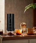 Lightning Fast Portable Electric Coffee Grinder With Smooth Ceramic Burr And 38 Adjustable Grind Settings on countertop, with ground coffee.