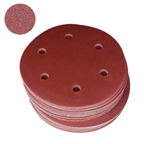 Rock Solid 50 Pack Of 9 Inch Aluminum Sanding Discs With 6 Holes And Hook Loop Backing, stacked for sanding wood and plasterboard.