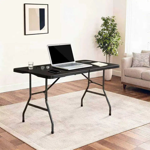 6Ft Folding Table With Built In Handle And Steel Legs Heavy Duty Portable Workhorse Party Table set up in living room, black top