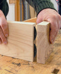 Fifty Pieces Plastic Biscuit Joiners Self Clamping Plate Joiner Tool Connectors for woodworking visible joining two wooden boards.