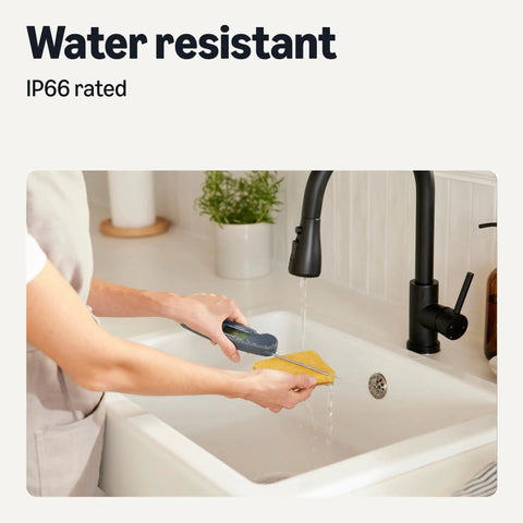 Instant Read Digital Meat Thermometer With Water Resistant Design being rinsed under a sink to show its IP66 rating.