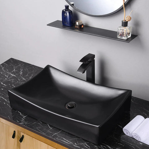 Sleek Porcelain Vessel Sink 26x15 Inches Above Counter Rectangle With Pop Up Drain Set shown on black counter