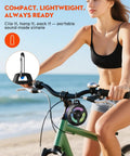 Woman on a bike with Waterproof Bluetooth Shower Speaker with Suction Cup IPX7 15W Loud Stereo Sound Deep Bass TWS Pairing And RGB Lights hanging from the handlebars.