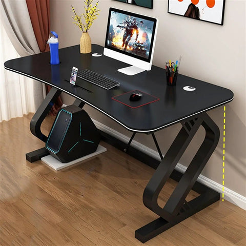 Game Ready Multifunctional Computer Desk With Built In Phone And Drink Slots Curved Gaming Table featuring a matte black surface and storage.