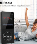 Woman enjoying FM radio feature on Pocket Size 32GB Bluetooth MP3 Player With Dope HiFi Sound, 1.8 Inch Color Display, headphones on.