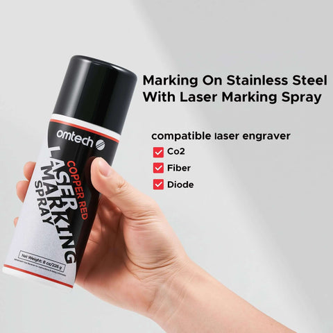 OMTech Copper Red Laser Marking Spray, 8 oz can, held in hand for CO2 laser engravers