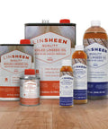 Various sizes of Fast Drying Boiled Linseed Oil For Wood Restoration And Protection Pro Grade Formula bottles on wood surface