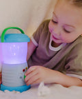 Child playing with Durable Light And Sound Camping Lantern Toy With Six Color Modes And Cool Sound Effects For Kids