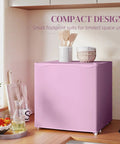 Slick 1.1 Cu Ft Compact Countertop Upright Freezer Featuring Smooth Temperature Dial And Handy Removable Shelf In Vibrant Pink on a kitchen countertop.