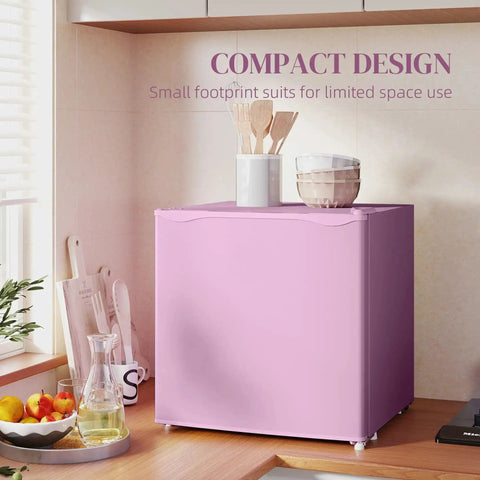 Slick 1.1 Cu Ft Compact Countertop Upright Freezer Featuring Smooth Temperature Dial And Handy Removable Shelf In Vibrant Pink on a kitchen countertop.