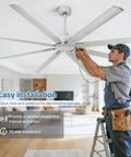 Installation of 84 Inch Large Ceiling Fan No Lights Industrial Quiet DC Motor with 8 Aluminum Blades by technician in modern room.