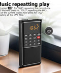Pocket Mini FM Radio And MP3 Player with USB TF Card Support displaying FM tuning on a wooden desk.
