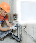 Worker using a Crush Proof 12X12 Inch Abs Plastic Drywall Access Panel for plumbing access in construction.