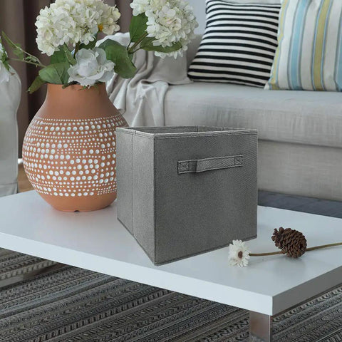 Three Pack Cube Storage Bins 9.0x7.5x7.5 Inches Foldable Fabric Closet Organizer collapsible gray bin on a table