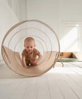 Toddler Tested Indoor Play Arena Featuring Super Soft Foam Climb Blocks Reconfigurable Crawl Tunnel used by a baby crawling inside.