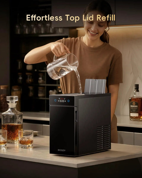 Woman refilling Crystal Clear Ice Ball Maker With CrystalFlux Technology For Countertop Use in home bar setting