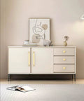 Modern dresser with brushed gold cabinet knobs installed, artistic decor on top, showcasing 10 Pack Brushed Gold Round Cabinet Knobs 1-1/5 Inch 30mm Single Hole Drawer Pulls For Kitchen Cabinets And Drawers Easy Install Durable Hardware For Cabinets And Furniture Renovation.