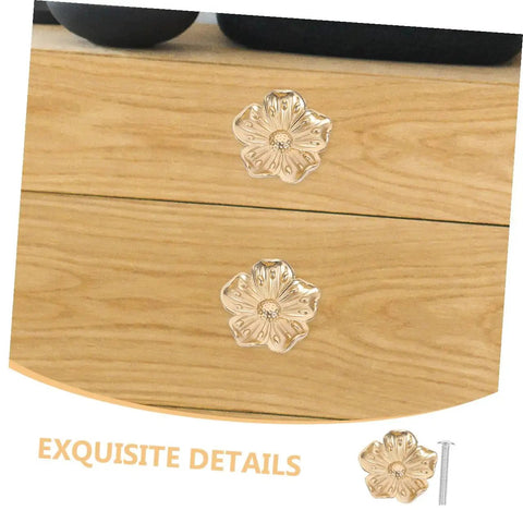 Brass Flower Cabinet Handles Set For Wardrobe And Dresser, mounted on wood drawers, showcasing vintage style decorative knobs.