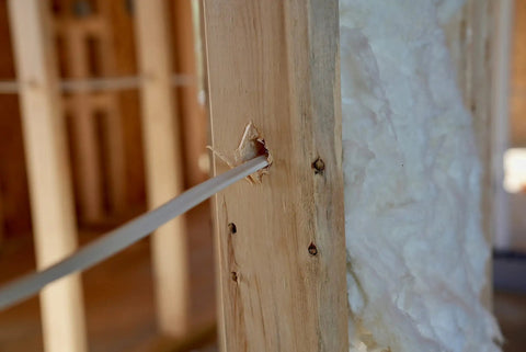 SimPull Solid Indoor 14/2 NM-B Cable With Ground For Easy Pull Installation In Dry Indoor Circuits threading through a wall stud