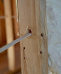 SIMpull Solid Indoor 14/3 W/G NM-B Copper Building Wire 100 Ft Coil threaded through wooden frame for residential wiring