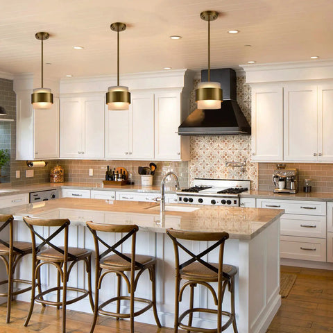 Gold Pendant Light Fixture With Frosted Glass Shade For Kitchen Island And Dining Room Modern Rod Hanging Lamp Adjustable Height To Set The Vibe In Any Bar Or Restaurant Setting Lighting With Warm Ambient Glow illuminating a kitchen.