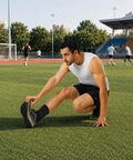 Man stretching with ankle brace for men and women with adjustable compression sleeve and wrap ion matrix support for sprained ankle plantar fasciitis Achilles tendonitis relief breathable running and sports gear all day comfort.