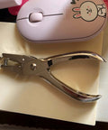 Circle Hole Punch Kit With One Quarter And One Eighth Inch Sizes Handy Handheld Puncher on desk with pink mouse