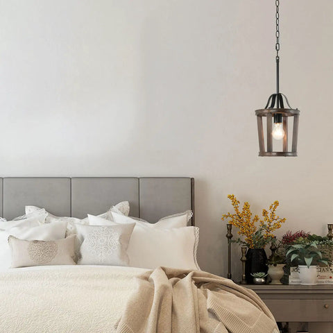 Dope Farmhouse Oak Wood Island Pendant Light with Bronze Finish over bedside, features 59 inch chain, E26 socket in bedroom.