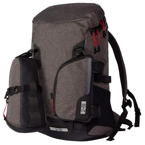 Outdoor backpack with large capacity and small detachable side bag. Visible durable fabric and multiple zippers.