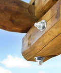 Two stainless steel flat washers, 3/8 in ID and 7/8 in OD, installed on bolts through a wooden beam