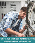 Man adjusting bike with Front And Rear Bike Axle Set For Mountain MTB Hollow Hub Shaft 108mm And 145mm Lengths