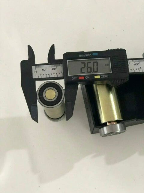 Badass 2x72 Belt Grinder Small Wheel Kit For Knife Makers And Bladesmiths measuring steel cylinder with a caliper at 26mm.
