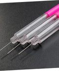 Close-up of transparent and pink Precision Oiler Pen For Watch Repair And Clock Work Pro Grade Oil Tool with fine tips