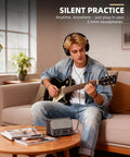 Musician using Portable 10W Bluetooth Guitar Amp With Built In Drum Machine Featuring 30 Patterns Clean And Drive Channel Reverb