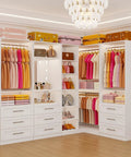 Sleek White Corner Closet System With Nine Wooden Drawers And Adjustable Shelves For Spacious Walk In Storage Organizer featuring hanging clothes, bags, and makeup.