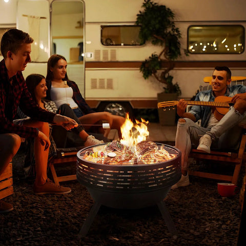 23 Inch Cast Iron Round Fire Pit With Grill And Flat Lid 3 In 1 Outdoor Fire Bowl Table Wood Burning Bonfire Pit in use at campsite