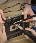 Hands using 2 In 1 Soldering And Hot Air Rework Station With 750W Power on a PCB, showing precise 212 F To 896 F temperature control.
