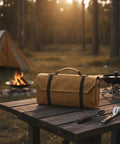 Canvas Knife Roll With Handle Portable Chef Tool Organizer for camping, on a wooden table near campfire, 13 by 3.3 inches.