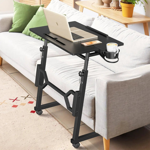 Small Standing Desk On Wheels For Treadmill Workouts, Portable Rolling Desk with Adjustable Height for laptop use, beside a sofa
