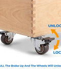 12 Pack 1 Inch Swivel Caster Wheels Real Deal Hardware Kit For Furniture Featuring Six Locking Brake Units And Six Freewheel Rollers Smooth Like Butter on a wooden storage unit with visible brakes.