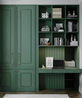 Green cabinetry with antique brass cabinet pulls, featuring desk space with shelves, for home office setup in traditional style.
