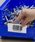 Hand inserting label card in ShelfMax bin with barcode, using Clear Label Card Holders And Printable Labels, 25 pack, 30210 to 30224 slots.